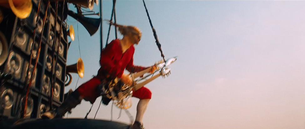 mad-max-fury-road-movie-screenshot-guitar-player-2.jpg