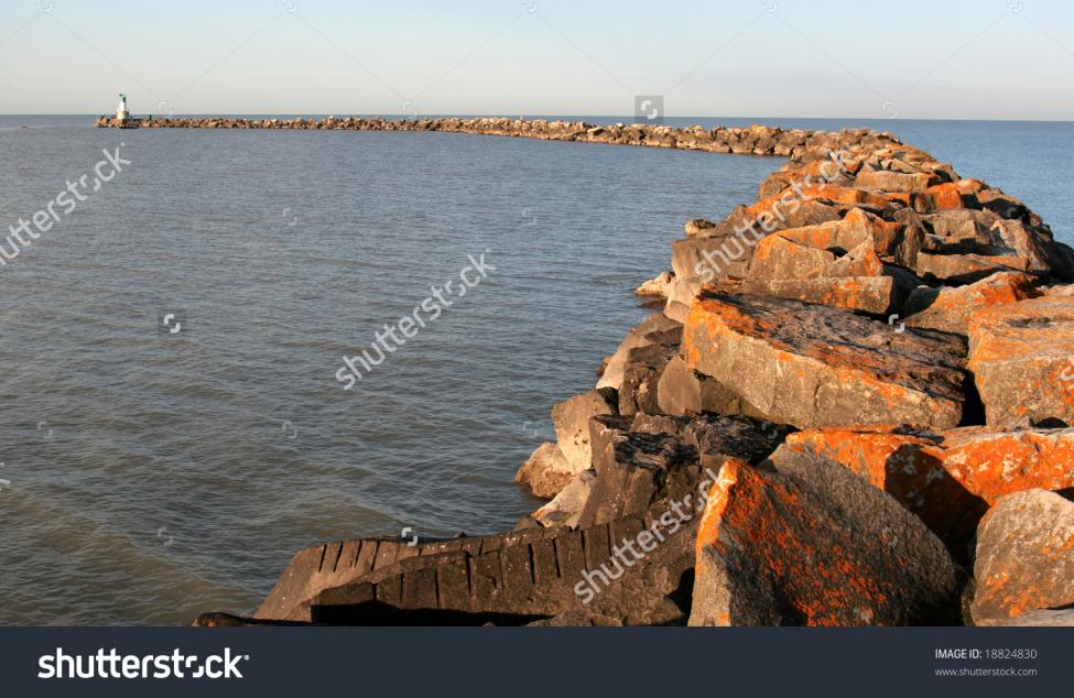 stock-photo-the-rock-pier-and-small-lighthouse-at-port-burwell-ontario-18824830.jpg