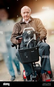 mature-elderly-old-man-wearing-a-nasal-oxygen-tube-riding-on-a-mobility-scooter-2BG6XA8.jpg