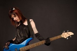 5072551-sexy-girl-in-crazy-outfit-with-bass-guitar-studio-shot.jpg